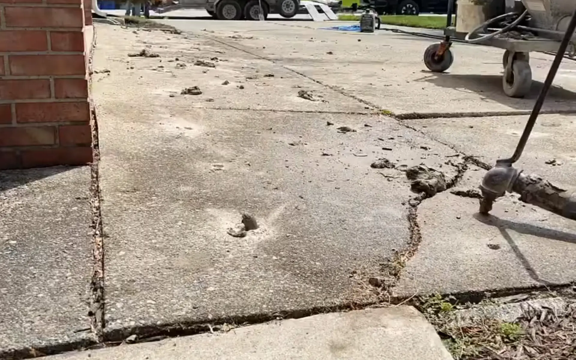 Mudjacking sunken concrete slab